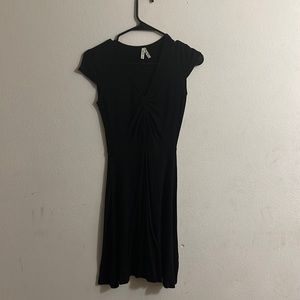 black flow dress with roushed chest.